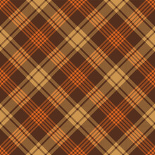 Brown And Orange Argyle Tartan Plaid. Scottish Pattern Fabric Swatch Close-up. 