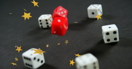 Wall Mural - Image of gold stars falling over white and red dice on grey background