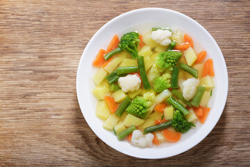 Wall Mural - plate of vegetable soup, top view