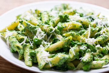 Canvas Print - plate of pasta with spinach, peas and parmesan cheese