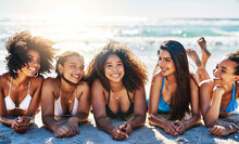Nothing Inspires Happiness Like A Beachy Day With Best Friends. Portrait Of A Group Of Happy Young Women Relaxing Together At The Beach.