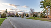 Fraser Heights, Surrey, Greater Vancouver, BC, Canada. Street View In The Residential Neighborhood During A Colorful Spring Season. Colorful Sunset Sky.