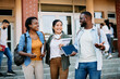 © Drazen - Multiracial group of happy students talk and have fun after the lecture at campus.