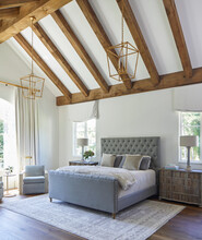 Bedroom With Vaulted Wood Beam Ceiling