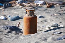 Closeup Of The Remnant Of An Old Gas Cylinder On The Beach