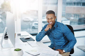 Poster - Success tastes better when youve worked hard for it. Portrait of a young businessman posing and in good spirits at his office desk.