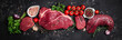 © Надія Коваль - Assortment of raw cuts of raw beef meat steaks with spices on a dark background. Long banner format. top view