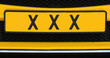 car with the text three Xs which are the symbol of the city of Amsterdam