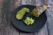 Plate of Japanese horseradish or wasabi on a wooden table