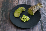 Fototapeta  - Plate of Japanese horseradish or wasabi on a wooden table
