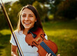 © Lyndon Stratford/peopleimages.com - Practicing in nature really inspires her even more. Cropped shot of a young girl playing a violin outdoors.