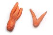 strange shaped carrots isolated on white surface