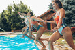 © BalanceFormCreative - A young group of people jumping into the swimming pool.Having fun and refreshing on a hot summer day.