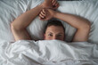© AS/peopleimages.com - Cute and comfortable. Cropped shot of a shirtless young man relaxing in his bedroom.
