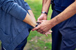 © Yuri Arcurs/peopleimages.com - Thatll hold you. Cropped shot of a policemans hands putting cuffs on a suspect.
