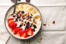 Bowl Of Millet Porridge With Frut Nuts And Dark Chocolate
