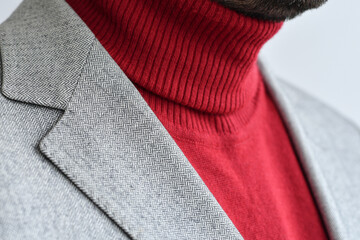 Wall Mural - Close up of men light tweed  blazer combined with bright red sweater.  Selective focus.