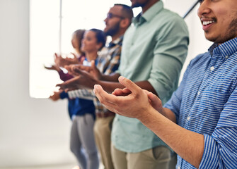 Poster - Success should always be celebrated. Cropped shot of a team of designers applauding together in an office.