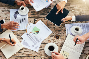 Poster - Everyone is in work mode. High angle shot of a group of unrecognizable businesspeople having a meeting while being seated around a table at a cafe outside during the day.