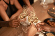 © N Felix/peopleimages.com - May we have many more years together as friends. Cropped shot of a diverse group of friends celebrating New Years together and toasting with glasses of champagne.