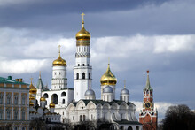 Ivan The Great Bell Tower, Spasskaya Tower And Orthodox Churches With Golden Cupolas In Kremlin On A Cloudy Spring Day