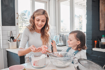 Wall Mural - This was why she enjoyed baking. Shot of a mother and daughter baking in the kitchen at home.