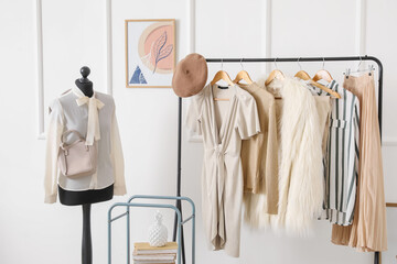 Rack with stylish clothes in modern studio of fashion stylist