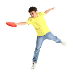 Wall Mural - Funny little boy playing frisbee on white background