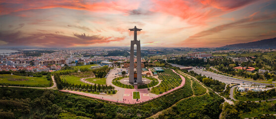 Aerial view of Sanctuary of Christ the King, Santuario de Cristo Rei. Lisbon, Portugal. Drone photo at sunrise.