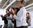 © Nikish H/peopleimages.com - It was a passion inspiring presentation. Shot of a group of businesspeople clapping during a conference.