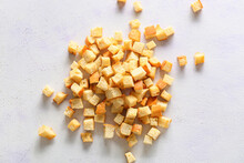 Many crunchy croutons on white background