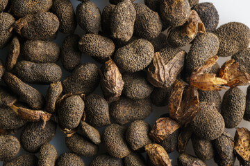 Dry seeds of Bakuchiol ingredient, macro shot, top down view.