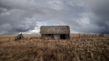 Abandoned Farm Buildings In Alberta In Early Spring.