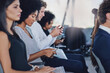 © AS/peopleimages.com - Taking notes on her mobile phone. Cropped shot of a group of businesspeople sitting in the conference room during a seminar.