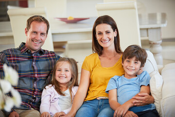 Wall Mural - Surrounded by love without any limits. Portrait of a happy family relaxing together at home.