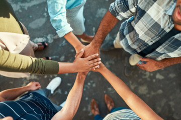 Aufkleber - Leave nobody behind. High angle shot of an unrecognizable group of work colleagues forming a huddle with their hands while standing in the office at work.