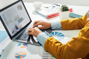 Fototapete - accountant using laptop computer on desk in office. business accounting concept
