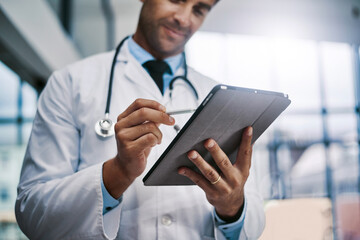 Canvas Print - Im in healthcare because I care. Cropped shot of a young male medical practitioner working in a hospital.