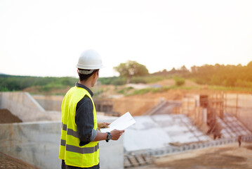 Young maintenance engineer working in dam