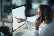 © Daniel Laflor/peopleimages.com - What career dedication looks like. Shot of a businesswoman using a computer and talking on the phone during a late night at work.