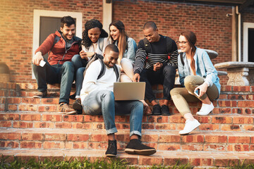 Aufkleber - Connecting with like minded young go getters. Shot of a group of students using a laptop together on campus.
