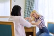 © Valerii Honcharuk - Female professional psychologist therapist talking to a teenage girl in office