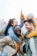 © EFStock - Youth, Love and friendship - Group Of Happy Young couple Friends Piggyback, having fun and laughing