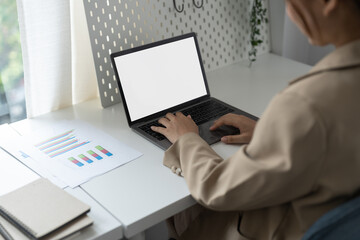 Young man working on his laptop with blank copy space screen for your advertising text message in office, Back view of business man hands busy using laptop at office desk