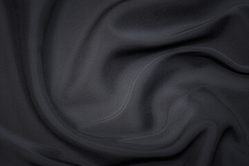 Wall Mural - Close-up texture of natural gray fabric or cloth in black color. Fabric texture of natural cotton or linen textile material. Gray or black canvas background.