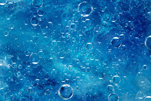Large Air Bubbles Under Water, Blue Background