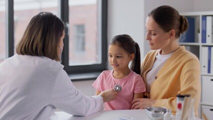 Poster - medicine, healthcare and pediatry concept - mother with little daughter and doctor with stethoscope at clinic