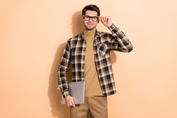 Wall Mural - Photo of confident guy hold netbook touch specs ready start up development seminar isolated pastel color background