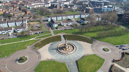 Wall Mural - Aerial image over the Doulton Fountain in Glasgow Green, a park next to the River Clyde near the City Centre.