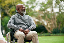 Taking In The Views. Cropped Shot Of A Handsome Senior Man Sitting In His Wheelchair Outside.